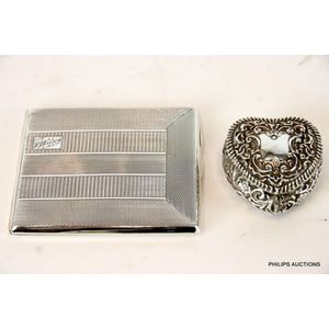 An Edwardian sterling silver box and a silver cigarette case,…