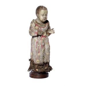 A carved and polychrome wooden figure of the Christ child,…