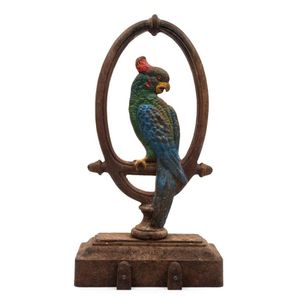 An antique cast iron parrot doorstop with hand-painted finish,…