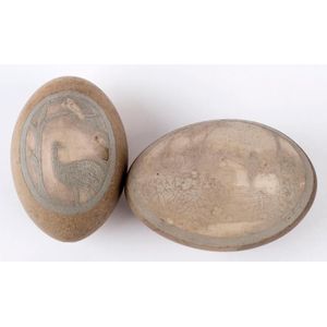 Two antique emu eggs with carved vignettes, late 19th century,…