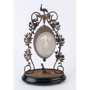 An antique Australian centrepiece, carved emu egg with lyre…