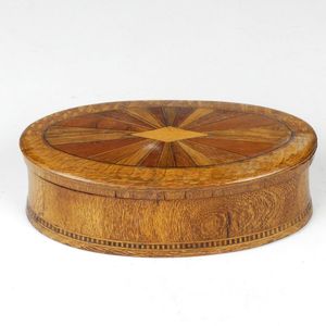 A small inlaid William Norrie dressing table box, oval with…