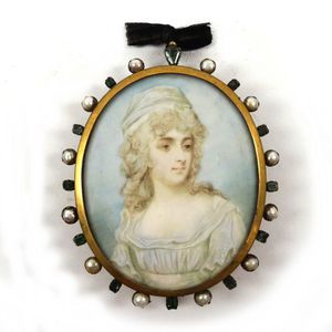 A hand painted miniature on ivory, a woman with flowing hair…
