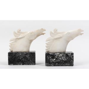 A pair of marble horse head bookends, 23 cm high