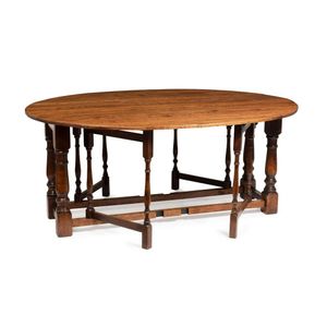 A French oak gateleg table, 75 cm high, 178 cm wide, 170 cm deep