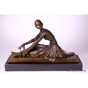 A bronze figurine of a seated Ballerina, after Chiparus, the…