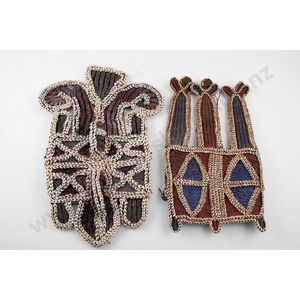 Two Papua New Guinea breast ornaments, each decorated with…