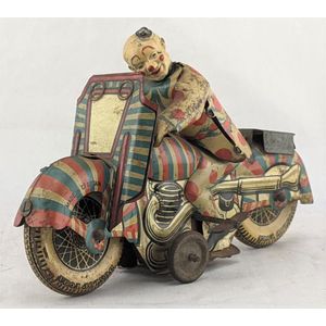 Mettoy, England: tin plate litho first prize clown on motorbike,…
