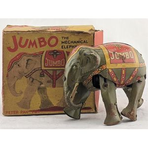 Peter Pan toys, England: a tin plate litho wind up Jumbo, the…