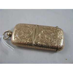 A gold book matchbox engine turned decoration early 1920s,…