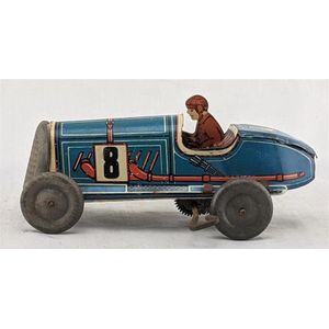 Memo, France: a tin plate wind up blue boat tail racing car…