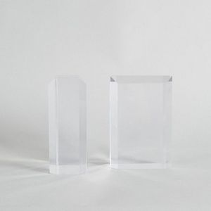 A pair of Lucite book ends, with faceted corners, height 15.3…