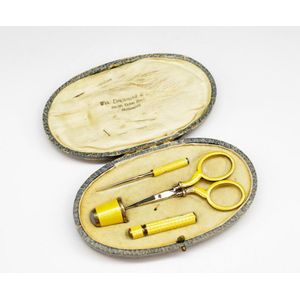 Vintage gold sewing kit with box