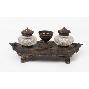 A sterling silver inkstand with faceted crystal inkwells by…