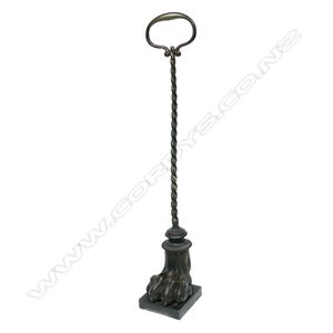A Victorian bronze doorstop, a lion's paw on stand with tall…