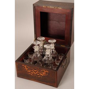 Late Georgian four decanter tantalus box, the rosewood box…