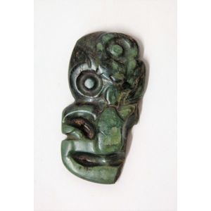A pre-European Maori pounamu hei tiki, the left arm and leg…