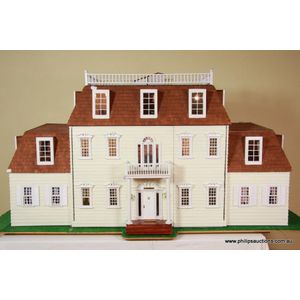 A fine fully fitted and wired timber dolls house, in the…