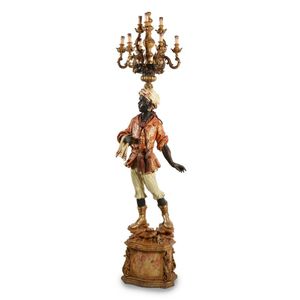 A Venetian style painted and giltwood blackamoor candelabra,…