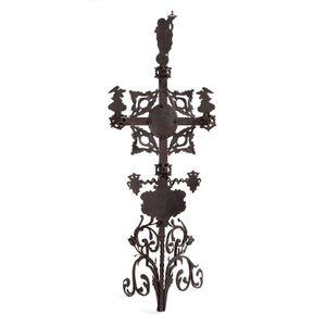 A Spanish forged wrought iron stand in the form of a cross,…