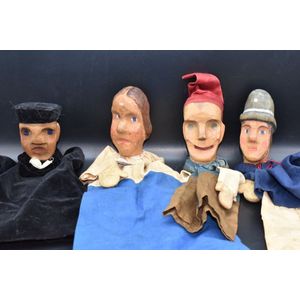 Four late 19th century Punch & Judy theme carved wooden head…