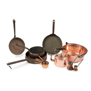 A collection of copper cookware, comprising saucepans, a basin…