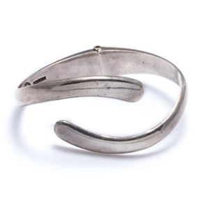 A Mexican silver bangle, hinged bangle with bypass terminals,…