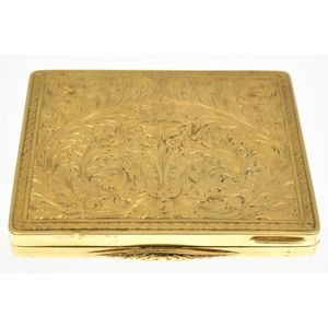 A gold case, the rectangular hinged case having finely chased…