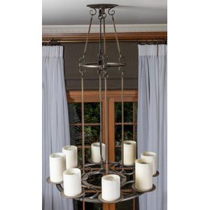 A wrought iron Baronial Revival eight light chandelier, 108 cm…