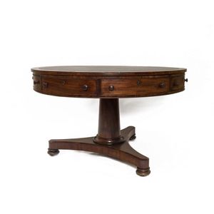 A Georgian mahogany leather topped circular drum library table,…