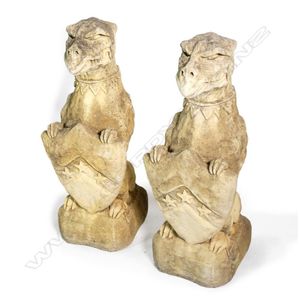 A pair of Churchstone 'Nasher' griffins, crouching holding a…
