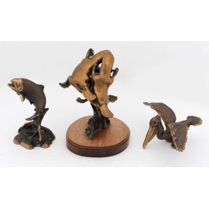 Three bronze animal statues comprising a rising trout, a…