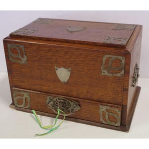 Oak Arts & Crafts writing compendium with dual mechanical doors,…