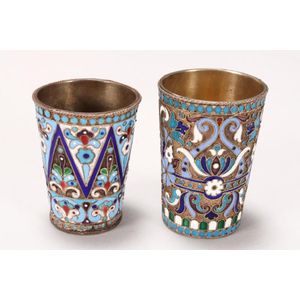 Two Russian silver and enamel vodka cups, both marked 84, the…