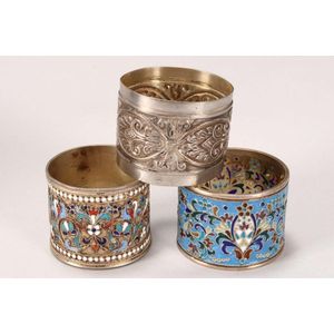 Three Russian silver napkin rings, marked 84, comprising two…