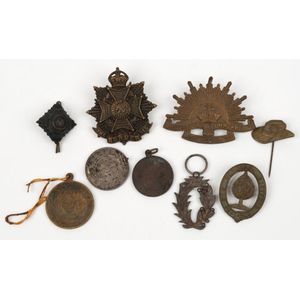 Small group of mainly World War I-era hat badges, fobs, etc. (9&hellip;
