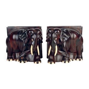 A pair of old ebony standing elephant bookends with ivory tusks…