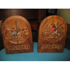Pair of carved bookends by Ellen Nora Payne depicting blue wren…