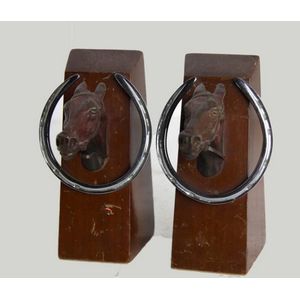 A pair of horse shoe bookends. Each of square flared form, with…