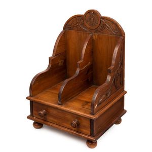 A carved cedar book shelf and desk compendium, late 19th…