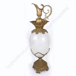 A large antique apothecary display bottle, teardrop shape in a…