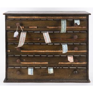 Pharmacist's label dispenser cabinet: manufactured by McCourt…