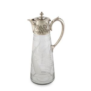 An antique claret jug, silver plate and glass with finely…