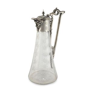 An antique English claret jug, engraved crystal with silver…