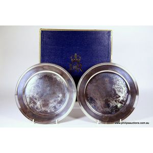 Two sterling silver plates commemorating the silver wedding of…