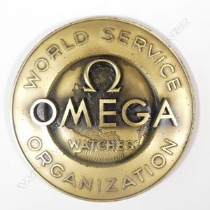 A c.1960s Omega 'World Service Organisation' gilt badge/plaque…