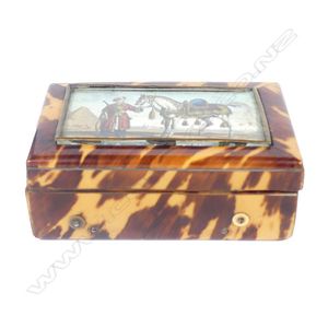 A 19th century tortoiseshell miniature music box, the hinged…