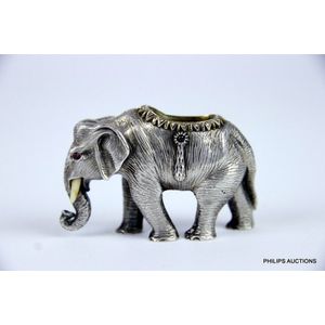 A Russian silver and gem set elephant match holder by Faberge,…