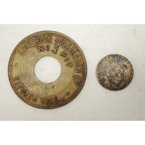 Two early trade tokens comprising of a Welsh Cabrian Collieries…