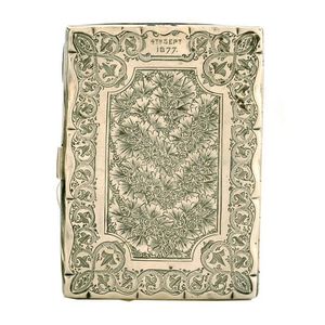 A Victorian fancy engraved silver and ivory notebook case,…